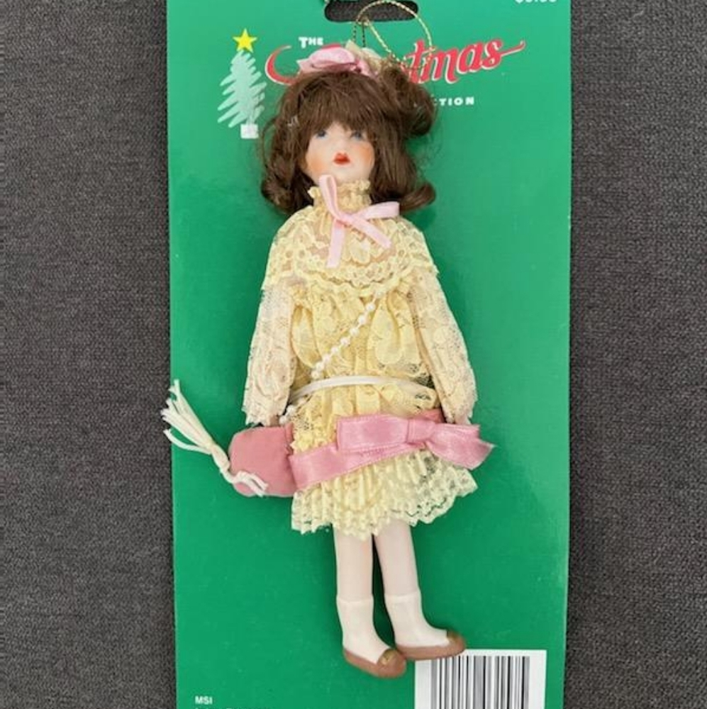 The Christmas collection Victorian Porcelain Doll Ornament With Crossbody Bag.